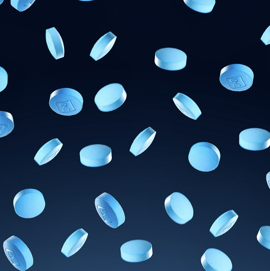 bluechew tablets falling on blue background